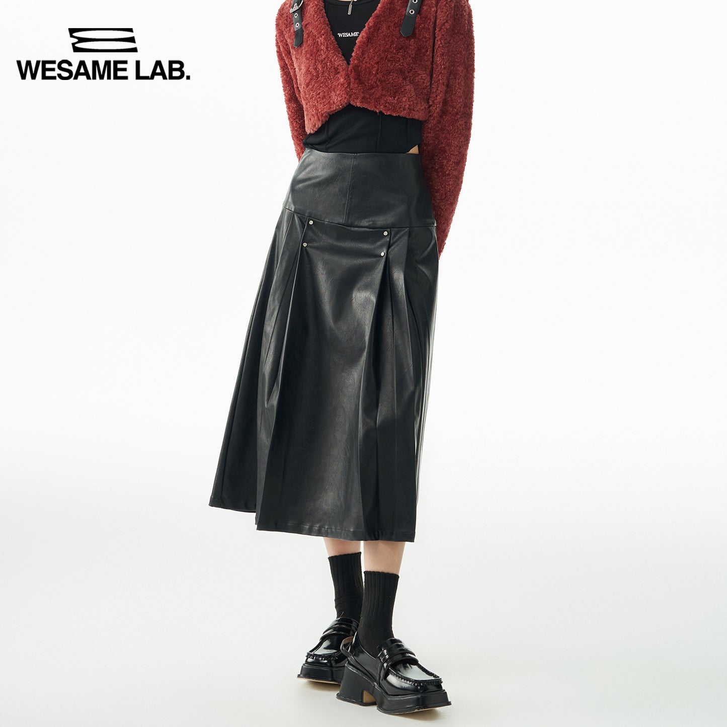 A-line rivet mid-length black leather skirt