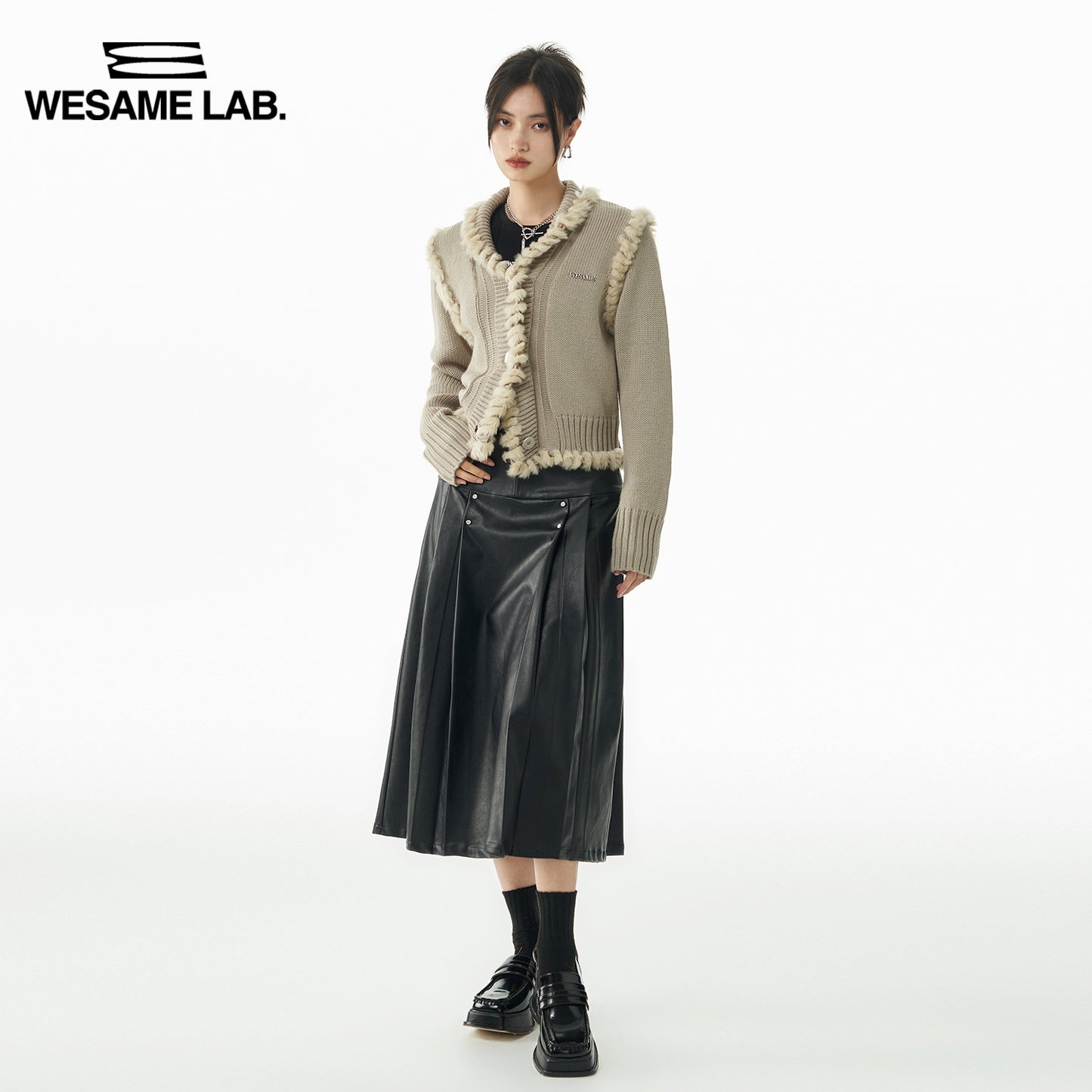 A-line rivet mid-length black leather skirt